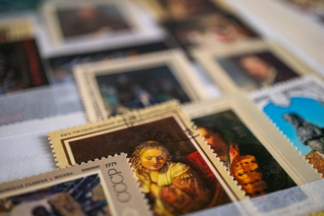 stamp collector examining stamps