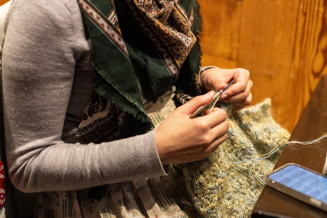 person knitting sweater