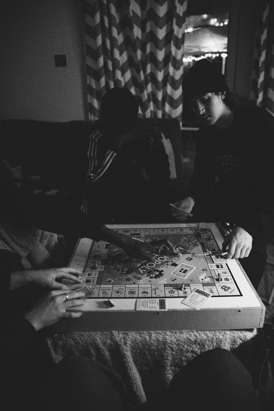 family playing board game